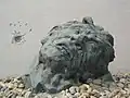 Statue of a victim being buried alive