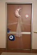 Nazar on a newborn baby's hospital room door in Turkey.