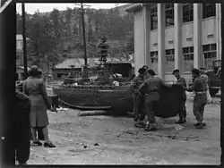 New Zealand Divisional Cavalry soldiers inspecting a model of a Japanese battleship on Etajima, 1946.