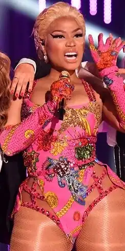 Trinidadian-born rapper Nicki Minaj features on the songs and music videos of Bang Bang, Side to Side and The Light Is Coming