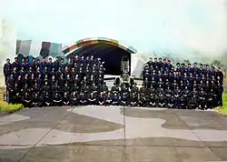 Men of the Squadron posing with one of their Folland Gnat fighter jets, a few months before the Indo-Pakistani War of 1971 broke out. Fg Offr Nirmal Jit Singh Sekhon, PVC is sitting in the 2nd row from the bottom, 4th from the right.