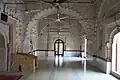 Multi-cusped arches divide the interior into three bays