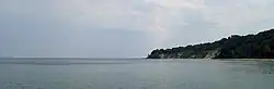 Cape Nordperd seen from Göhren Pier. Left of the cape is the Buskam