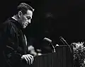 Black-and-white image of Hackerman speaking
