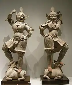 Pair of unglazed lokapala