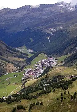 A view of Obergurgl (below) and Hochgurgl (above) in summer, looking north. The road climbing past Hochgurgl goes to Italy via Timmelsjoch.