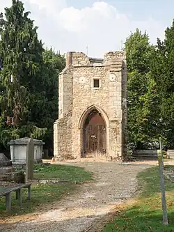 Remains of tower of former Church of St Margaret in old churchyard