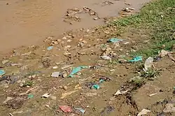 Evidence of open defecation along a riverbank in Bujumbura, Burundi