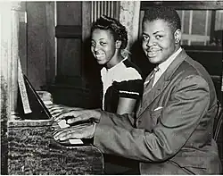 Oscar Peterson with his sister, Daisy, at the piano, 1944