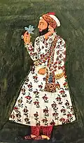 Portrait of Guru Har Rai holding a blue flower