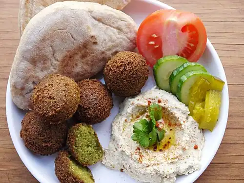 Arab breakfast with falafel, hummus, torshi and khubz bread