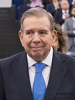 Headshot of González in a suit