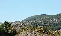 Curving mountain/hill landscape with a detailess sky
