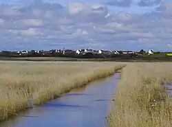 A distant view of Plovan, from the tidal marshes of the Bay of Audierne.