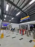 The fare gates of the station from the new building via the W.R. Supratman street near the station tunnel.