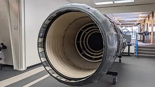 The afterburner was rated for continuous operation at 3,200&nbsp;°F (1,800&nbsp;°C) made possible with ceramic coatings (colored white) on duct liner and flame holders[88] and compressor bleed air cooling the duct and nozzle (above Mach 2.1 when the bleed was flowing). The nozzle is fully open, the maximum afterburning position. The main purpose of the variable nozzle area was to control engine operation which it did in conjunction with varying heat release in the afterburner.