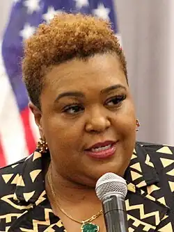 Precious McKesson speaking while holding a microphone