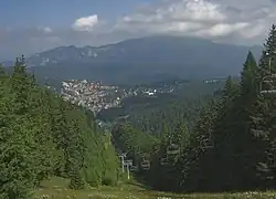 View of Predeal from Clăbucet-plecare Chalet (1,445m);[3] behind is the Postăvarul massif