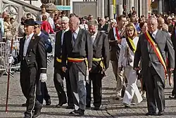 Patrick Moenaert, Mayor of Bruges (left), and Paul Breyne, Governor of West Flanders (right), both in morning dress along with formal trousers at the Sanguis procession in Bruges, Belgium.