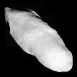 Cassini image (with moon's Saturn-facing end at lower right) reveals a surface covered with a blanket of fine material.