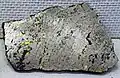 Pentlandite occurring with pyrrhotite, chalcopyrite, and magnetite. Specimen from Sudbury, Ontario, Canada