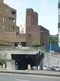 The Dock entrance to the Queensway Tunnel, with the brick New Quay Ventilation Station in the centre of the picture (1925–31; Grade II)