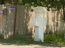 A cross located next to the town hall, where people were killed during World War II