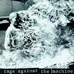 A black-and-white image of a man being burned alive. The album title/band name is shown at the bottom in lowercase letters with a black background.