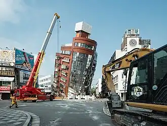 Rescue workers near the semi-collapsed ten-story Uranus Building on Xuanyuan Road after the 2024 Hualien earthquake