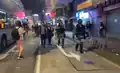 Riot police raise a blue flag on Cheung Sha Wan Road.