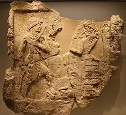 King Iddin-Sin of the Kingdom of Simurrum, holding an axe and a bow, trampling a foe (c. 1950 BC). Israel Museum.