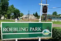 Entrance sign by Roebling Park