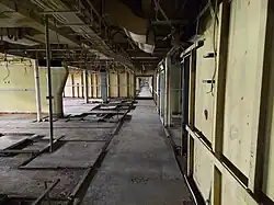 A passageway with the footprint of first-class staterooms on the left.
