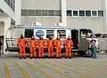 Melvin (center) with STS-129 crew members boarding the astrovan