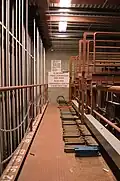 Loading bridge. Weights are seen on floor.
