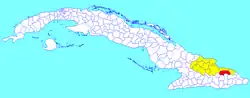 Sagua de Tánamo municipality (red) within Holguín Province (yellow) and Cuba
