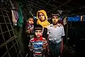 A Rohingya mother with her three children mourning for her elder son