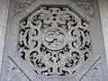 Window details. The fish design forms a Yin Yang symbol, surrounded by the bagua symbol.