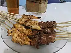 Cooked sate kambing (right) have darker colour compared to chicken satay (left)