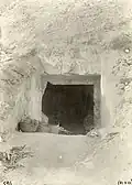 Entrance to the tomb at the time of its discovery, 1903. Inside, there are still numerous sarcophagi from a later period that were found when the tomb was opened, waiting to be taken to the camp (two of these can still be seen glimpsing in the darkness of the tomb's transverse hall).