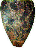Shield of Seedorf (late 12th century), the oldest extant medieval shield, showing a lion rampant. Preserved in Seedorf monastery, Uri, Switzerland. In origin still of the kite shield type, the top of the shield has been cut off at a later date to approximate the 13th-century "heater" shape.