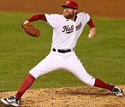 Sean Doolittle in the middle of throwing a pitch in a white Washington Nationals uniform