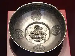 Lute player. Samanid (or Seljuk)[84] metal work, Khorezm, 10th century. Islamic Art Museum (Museum für Islamische Kunst), Berlin.[85]