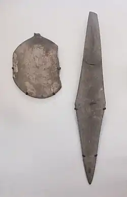 Siltstone palette in the shape of a turtle, and rhombus-shaped schist palette. Abadiya Grave B102. Naqada IIA. Ashmolean Museum