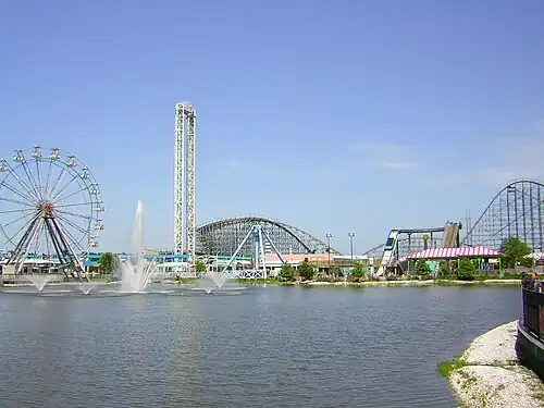Waterfront view west from Main Street Square over Crescent City Basin; L–R: prominent rides include The Big Easy ferris wheel, Bayou Blaster/Sonic Slam, Ozarka Splash and Mega Zeph