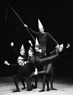A troupe of performers act out a play