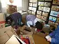 Volunteers of a Czech diocesan Caritas cleaning the second-hand wardrobe.