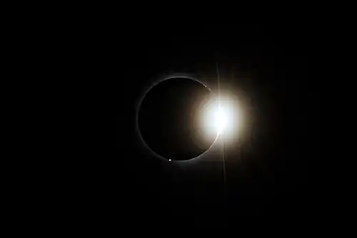 Post-totality diamond ring effect visible during the total solar eclipse of April 8, 2024, in Montreal, Quebec, viewed from Lower Field at McGill University.