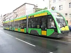 Yellow and gree five-section tram