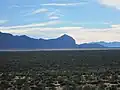 View of the Sonoran Desert from Huerfano Butte. The southern end of the Santa Rita Mountains can be seen in the background.